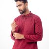 Maroon fitted Panjabi in Jacquard Cotton fabric. Designed with a mandarin collar and matching metal buttons on the placket. Embellished with karchupi at the top front.