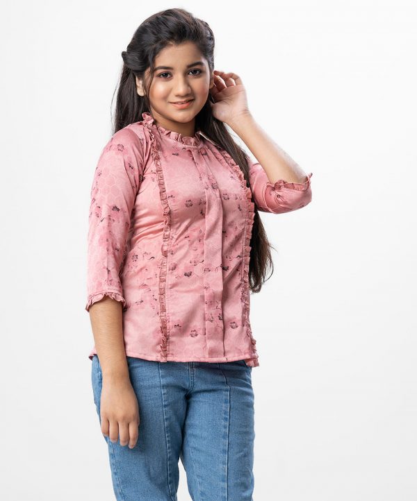 Pink all-over printed A-line Woven Top in Crepe fabric. Designed with a frilled round neck and three-quarter sleeves. Frills detailing at the front and cuffs. Button opening at the back.