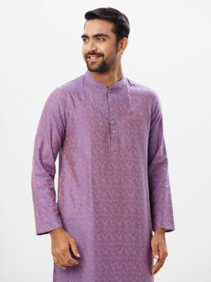 Purple fitted Panjabi in Jacquard Cotton fabric. Designed with a mandarin collar and matching metal buttons on the placket. Embellished with pin tucks at the top front.