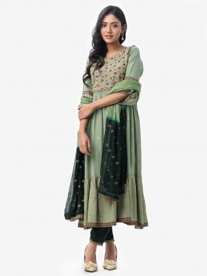 Silk & Viscose blended gown style Salwar Kameez. Bell sleeved, boat neckline and karchupi with beads. Printed chiffon dupatta with pant-style pajamas.