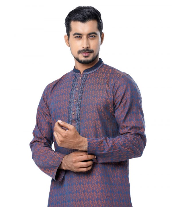 Blue semi-fitted Panjabi in Jacquard Cotton fabric. Embellished with embroidery on the collar and placket. Matching metal button fastening on the chest.