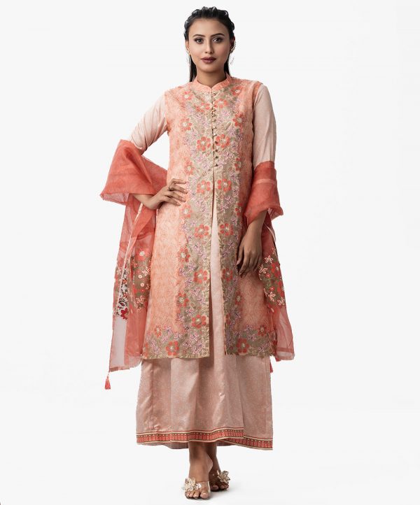 Exclusive gown and shrug-style salwar kameez set from Nargisus by Le Reve. Floral printed muslin shrug with karchupi. Sleevless crepe gown with muslin dupatta.