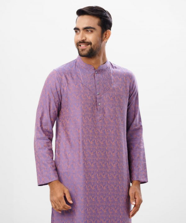 Purple semi fitted Panjabi in Jacquard Cotton fabric. Designed with a mandarin collar and matching metal buttons on the placket. Embellished with pin tucks at the top front.