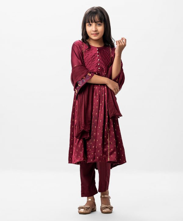 Maroon all-over printed Salwar Kameez in Crepe fabric. The Kameez is designed with a round neck and bell sleeves. Detailed with pin tucks and pearls attached at the front. Lace attachment at the front and back. Gathers from the waistline. Complemented by culottes pants and chiffon dupatta.