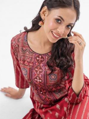 Maroon all-over printed A-line Kameez in Crepe fabric. Designed with a round neck and three-quarter sleeves. Embellished with karchupi at the top front. Single button opening at the back. Unlined.