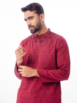 Maroon semi-fitted Panjabi in Jacquard Cotton fabric. Designed with a mandarin collar and matching metal buttons on the placket. Embellished with karchupi at the top front.
