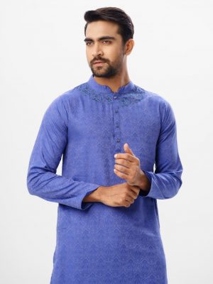 Blue semi-fitted Panjabi in Jacquard Cotton fabric. Designed with a mandarin collar and matching metal buttons on the placket. Embellished with karchupi at the top front.