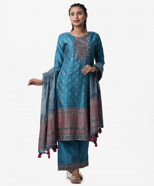 Printed blue straight salwar kameez in silk fabric. Quarter sleeved and karchupi with mirror. Half-silk dupatta and palazzo pants.