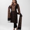 Floral printed A-line salwar kameez in viscose fabric. Full sleeved, boat neck and karchupi with mirror at front. Muslin dupatta with pant-style pajamas.