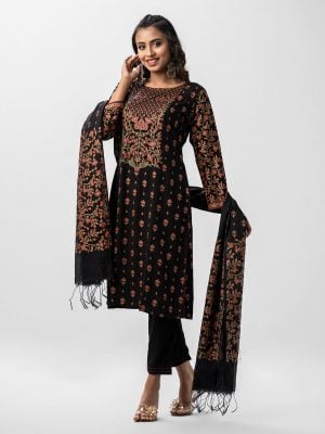 Floral printed A-line salwar kameez in viscose fabric. Full sleeved, boat neck and karchupi with mirror at front. Muslin dupatta with pant-style pajamas.
