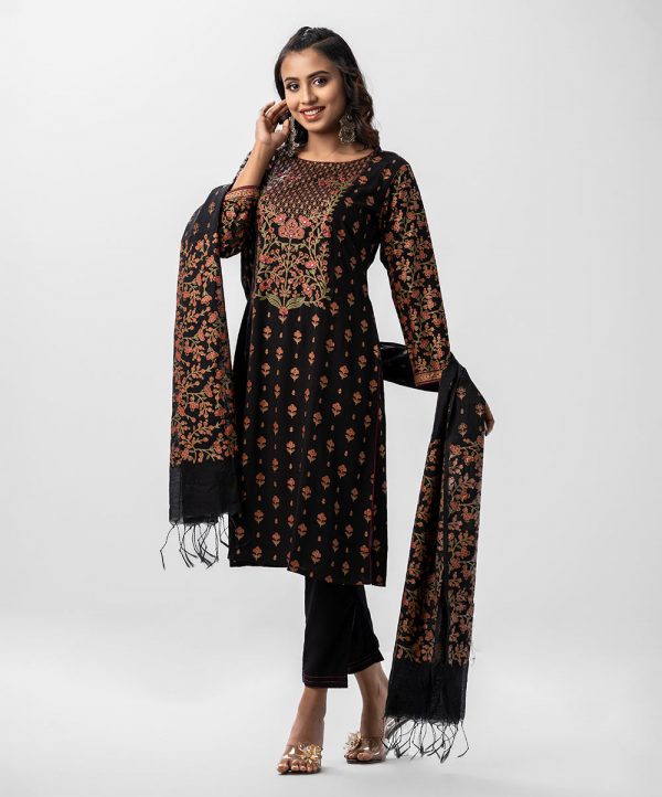 Floral printed A-line salwar kameez in viscose fabric. Full sleeved, boat neck and karchupi with mirror at front. Muslin dupatta with pant-style pajamas.