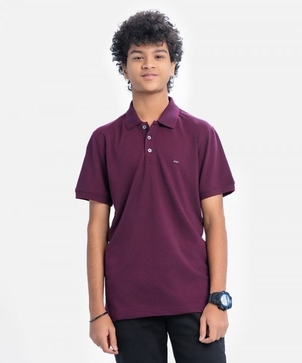 Teen boy short-sleeved polo shirt in cotton pique fabric. Rib collar.