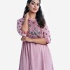 Printed A-line kameez in zoom fabric. Mock neck, three-quarter sleeved. Attach Patch and karchupi at the hemline and sleeve.