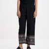 Women's casual palazzo in viscose fabric. Concealed elasticated waistline.