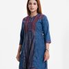 Woman's printed A-line tunic in denim fabric. Three-quarter sleeved, band collar. Embroidery and line stitching at front.