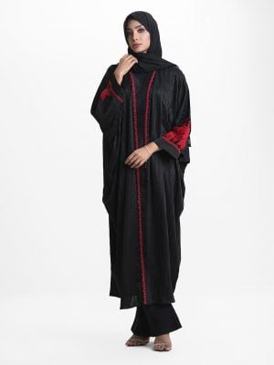 Women's long abaya in design georgette fabric. High neck with zoom fabric patch and lace work at the front. Rose cutwork in velvet fabric at sleeves.