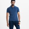 Men's polo shirt in stretched cotton knit fabric. Classic collar, short sleeves and a straight-cut hem.