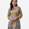 Luminescent striped long A-line tunic in viscose fabric. Line stitching at band neck and placket. Karchupi at front.