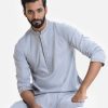 Men's fitted panjabi in blended cotton fabric. Embroidery and karchupi at front with hidden button placket.