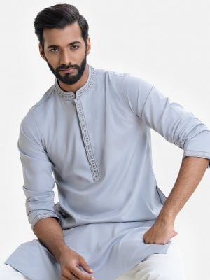 Men's fitted panjabi in blended cotton fabric. Embroidery and karchupi at front with hidden button placket.