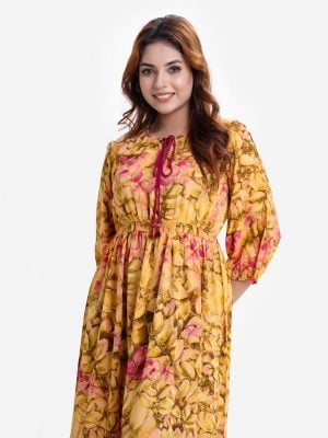 Women's long pattern flared Maxi in printed georgette fabric. Round neck with tassel ties, three-quarter sleeves. Smokey gathered waistline and patch at hem.