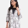 Women's floral printed high-low hem style kameez in printed georgette fabric. Contrast patch on collar, three-quarter sleeves and bottom hemline. Gathered waistline with side open.