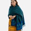 Women's shawl in viscose fabric. Comes with embroidery work and fringe trim at the border.