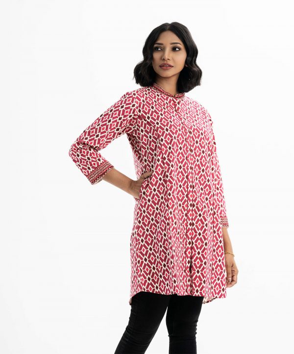 Ikat printed A-line tunic in cotton fabric. Embroidery work at mandarin collar and full sleeves hem. Inseam pockets.