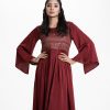 Women's abaya-style gown in crepe fabric. Round neck, slit bell sleeves. Box pleated waistline. Karchupi and floral print detail at front.