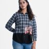 Women's check shirt in flannel fabric. Long sleeve, classic collar with button fasting and a front pocket. Floral print at the hemline.