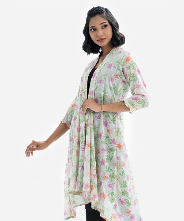 Women's floral printed long shrug in Georgette fabric. Open front with shawl collar, full sleeves with frill trim hem.