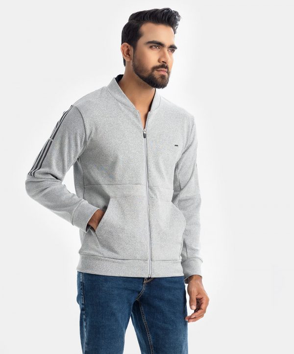 Men's winter solid color slim fitted sweat shirt in French terry fabric. Full sleeves, stand collar. Zipper opening with kangaroo pockets. Reflecting stripes at sleeves.