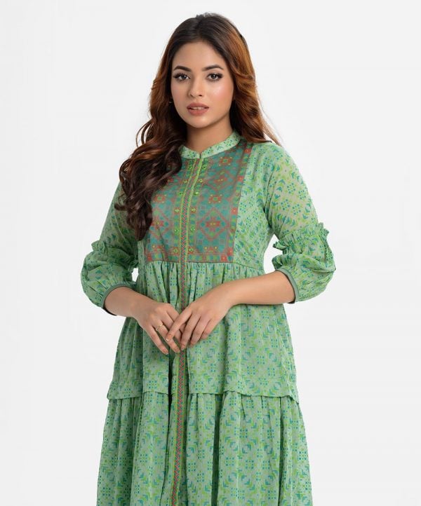 Women's geometric printed frock style long tunic in georgette fabric. Mandarin collar, lantern sleeves. Printed patch at the front.
