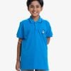 Kid boys short-sleeved polo shirt in cotton pique fabric. Soccer ball print print at front. Twill tape attaches to the collar and sleeves.