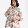 Printed ladie's shirt in viscose fabric. Classic collar, bishop sleeved. Button fasting at the front and attached lace at the waistline.