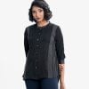 Ladie's printed shirt in georgette fabric. Stand collar, long-sleeved. Button fasting and line stitching at the front.