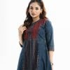 Woman's A-line tunic in denim fabric. Three-quarter sleeves, stand collar with placket. Embroidery at front.