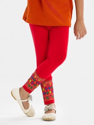Kid girl's leggings in stretchable cotton knit fabric. Concealed elasticated waistline and print at hemline.