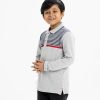 Kid boy's polo shirt in cotton pique fabric. Classic neck, long sleeves. Stripe print at the front.