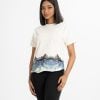 Ladies' printed T-shirt in cotton single jersey fabric. Round neck, short sleeves and elongated hem with ocean print detail.