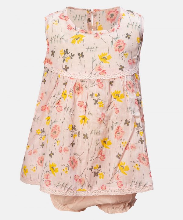 Sleeveless tent-style newborn baby girls frock in cotton fabric. All-over floral printed with lace work at the chest and hemline.