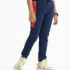 Kid boys slim fitted track pant in french terry fabric. Concealed elasticated waistline with drawstring cord. Two side pockets and a back pocket.