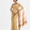 All-over printed Saree in Cotton fabric. Embellished with embroidery, and fringe trim at the border of Aanchal.