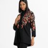 Women's printed jacket in twill fabric. Shawl collar, long-sleeved. Button fastening and two pockets at the side.