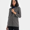 women's blazer in check fabric. Long-sleeves, lapel collar with two-button fasting and two-jetted pockets.