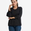 Women's top in georgette fabric. Mock neck, long puff sleeved. Stone and pin-tuck at the front.