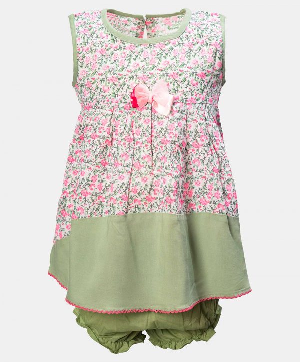 Sleeveless layered newborn baby girls frock in cotton fabric. Floral printed fabric layer attached.