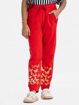 Kid girl's sweat pant in interlock knit fabric.Concealed elasticated waistline with adjustable drawstring. Two side pockets with frill trims and a back pocket. Butterfly printed.