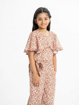 KId's girl jumpsuit in printed georgette fabric. Round neck, circular sleeved. Two side pockets with waistbelt and wrap layer at the front.