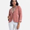 Ladie's blazer in interlock fabric. Lapel collar with karchupi, full-sleeved. Button fasting and jatted pockets at the front.